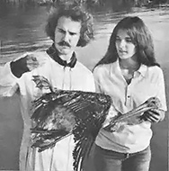 Ralph Heath and an assistant at the Suncoast Seabird Sanctuary care for a pelican.